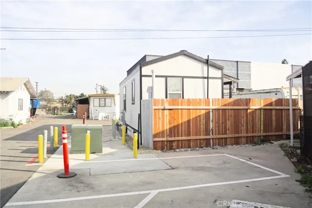 a view of a building with a bench and floor to ceiling windows