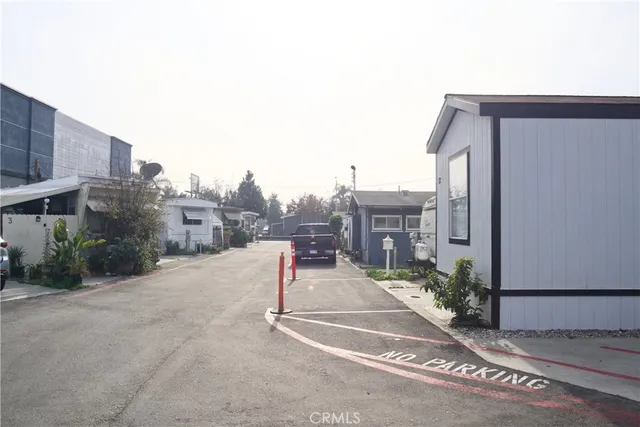 a view of a street with a building in the background