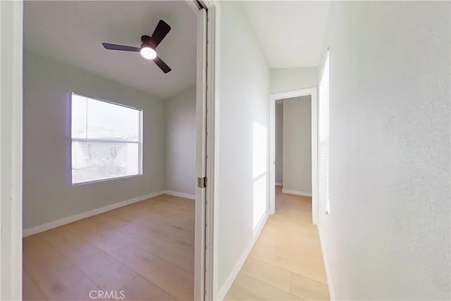 a view of hallway with windows