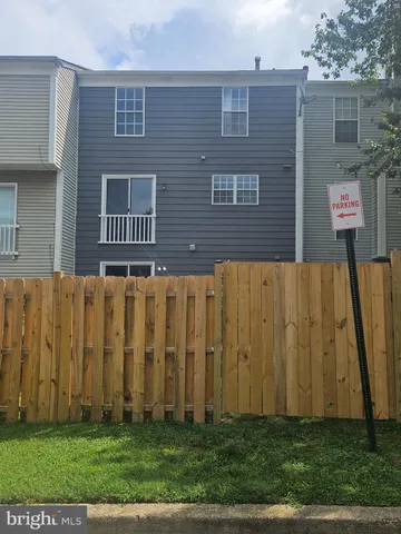 a brick building with a yard