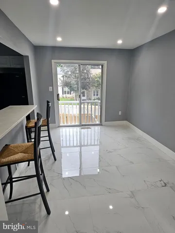 a view of an empty room and bathroom