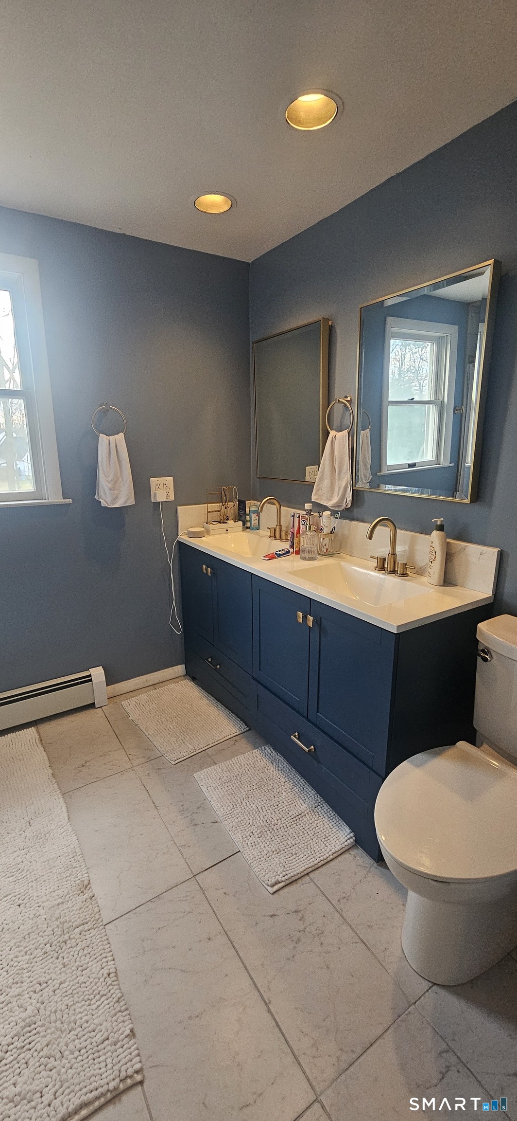 60 Nod Road Windsor, CT 06095 - Photo 15 of 38 a room with a sink and mirror
