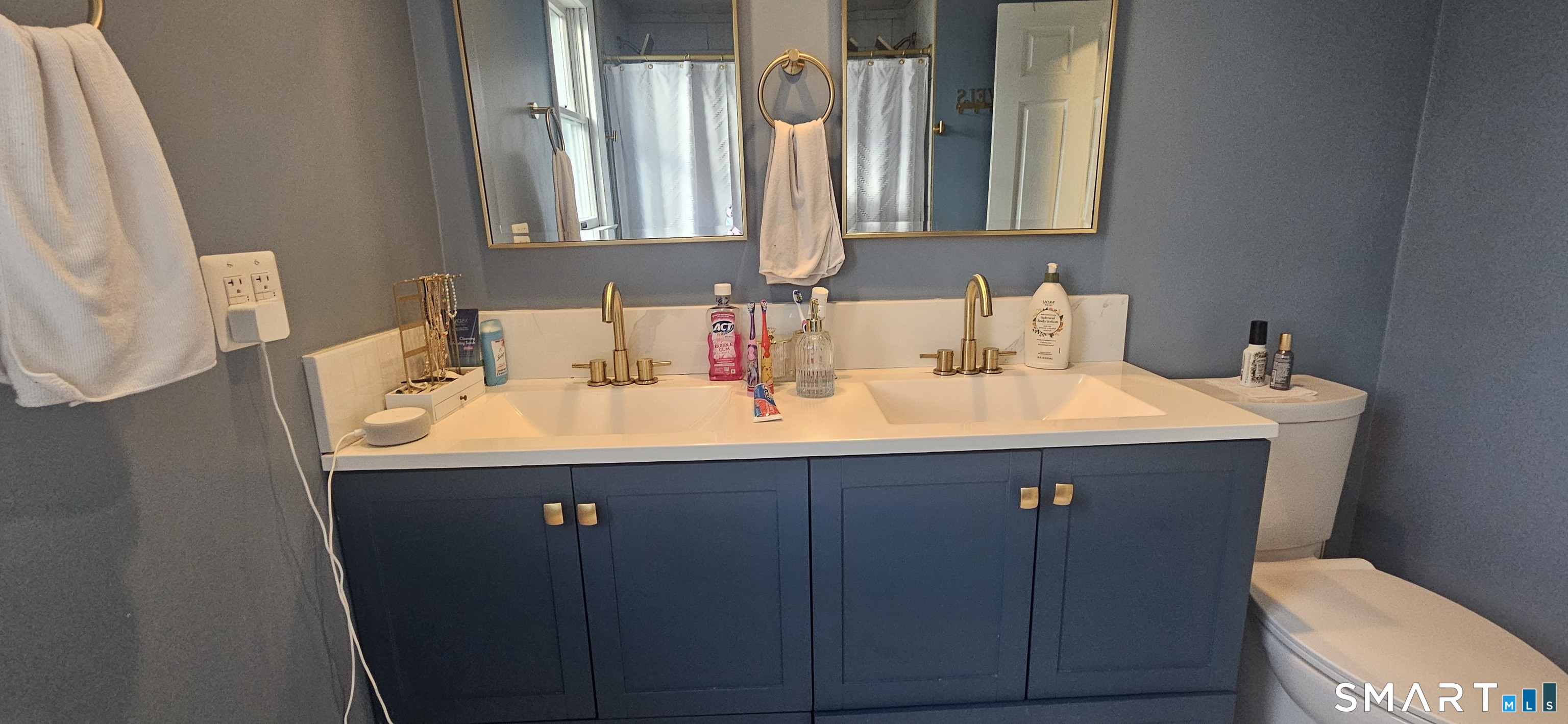 60 Nod Road Windsor, CT 06095 - Photo 17 of 38 a bathroom with a sink and a mirror