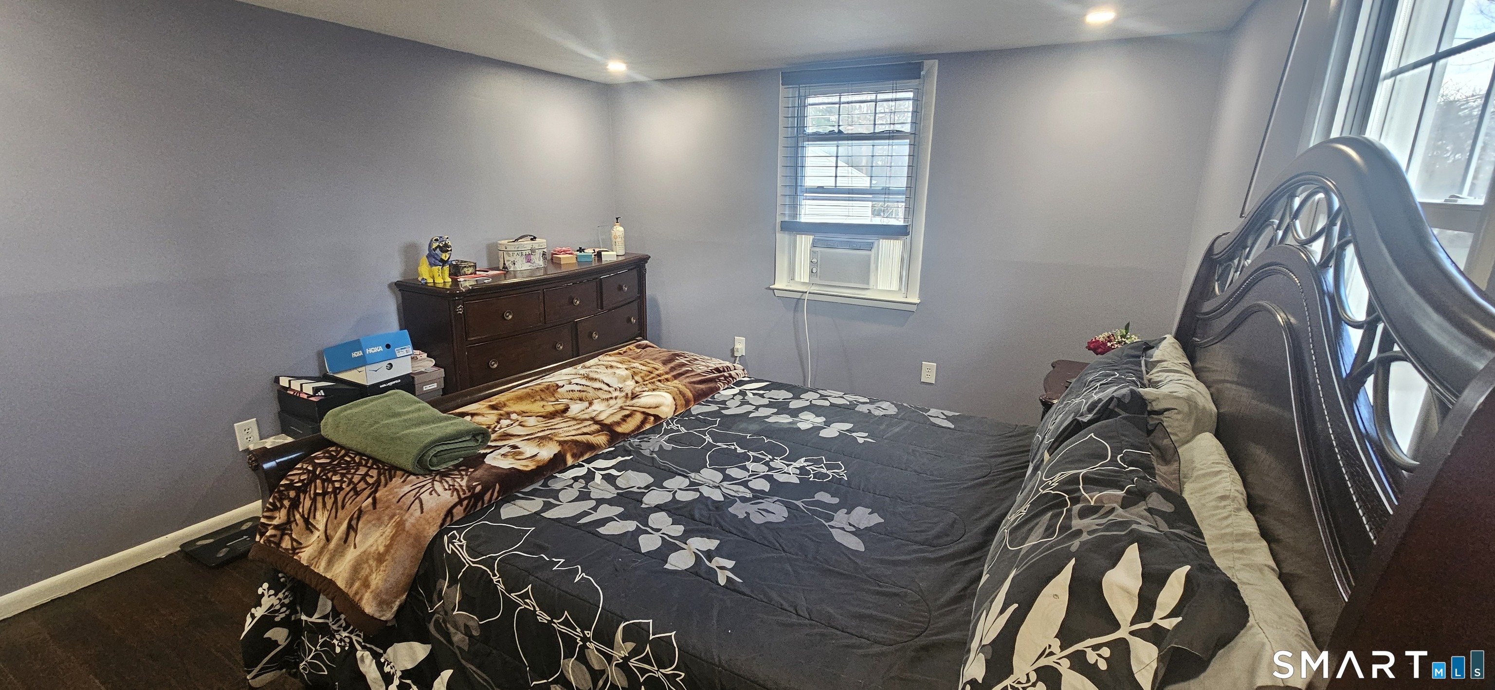 60 Nod Road Windsor, CT 06095 - Photo 20 of 38 a bed sitting in a bedroom next to a window