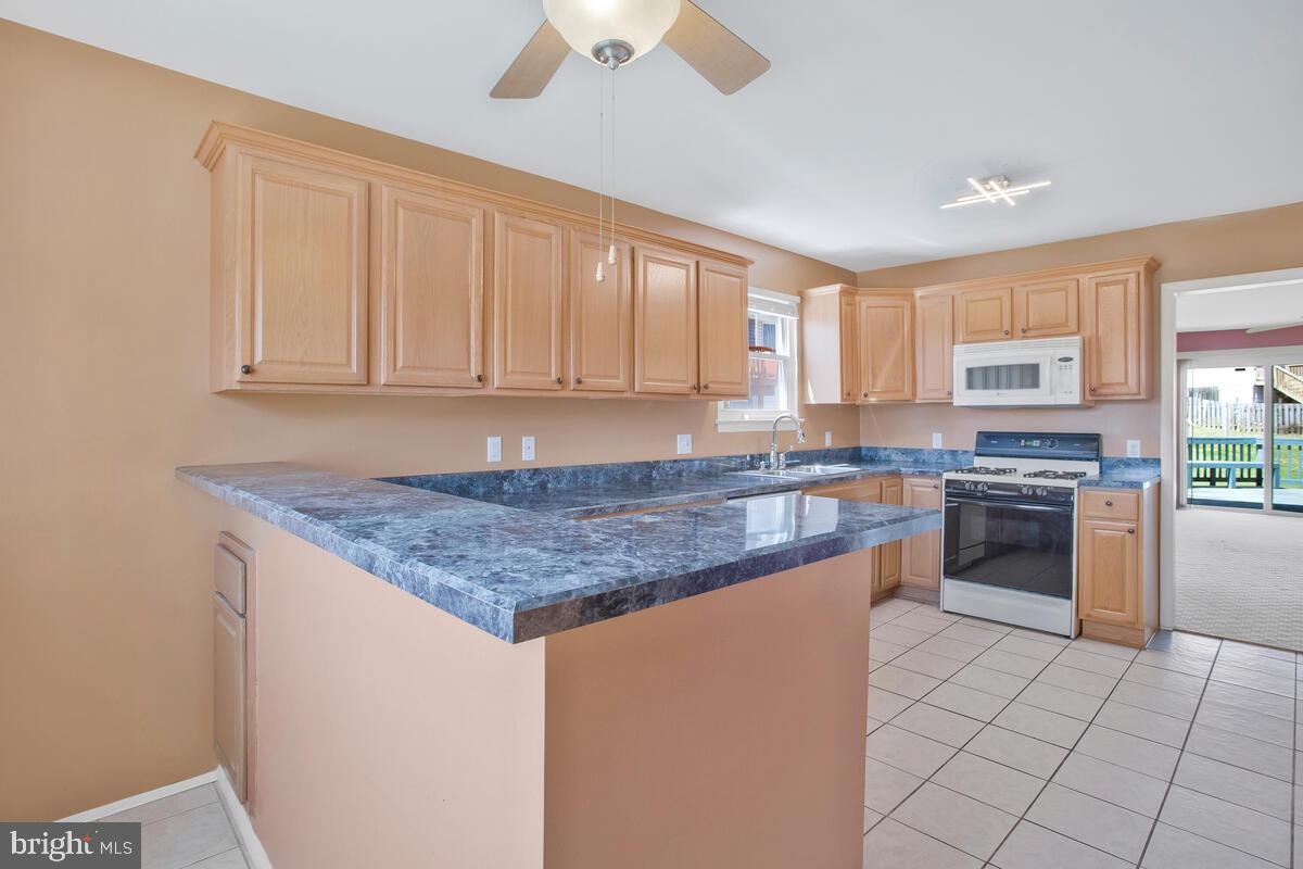 9930 Tuscarora Road Randallstown, MD 21133 - Photo 3 of 35 Updated kitchen with breakfast bar