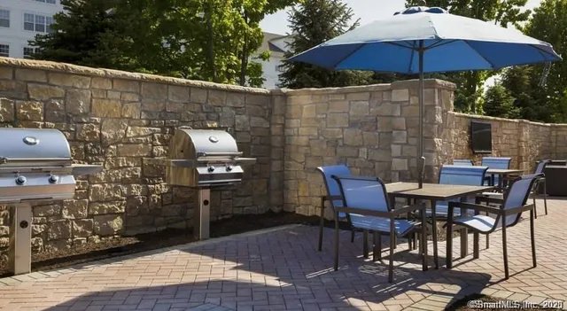 a patio with table and chairs