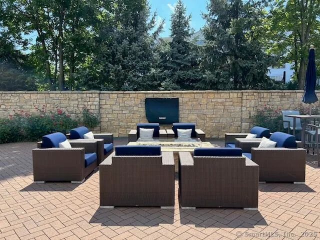 a dining room with a wooden table and chairs