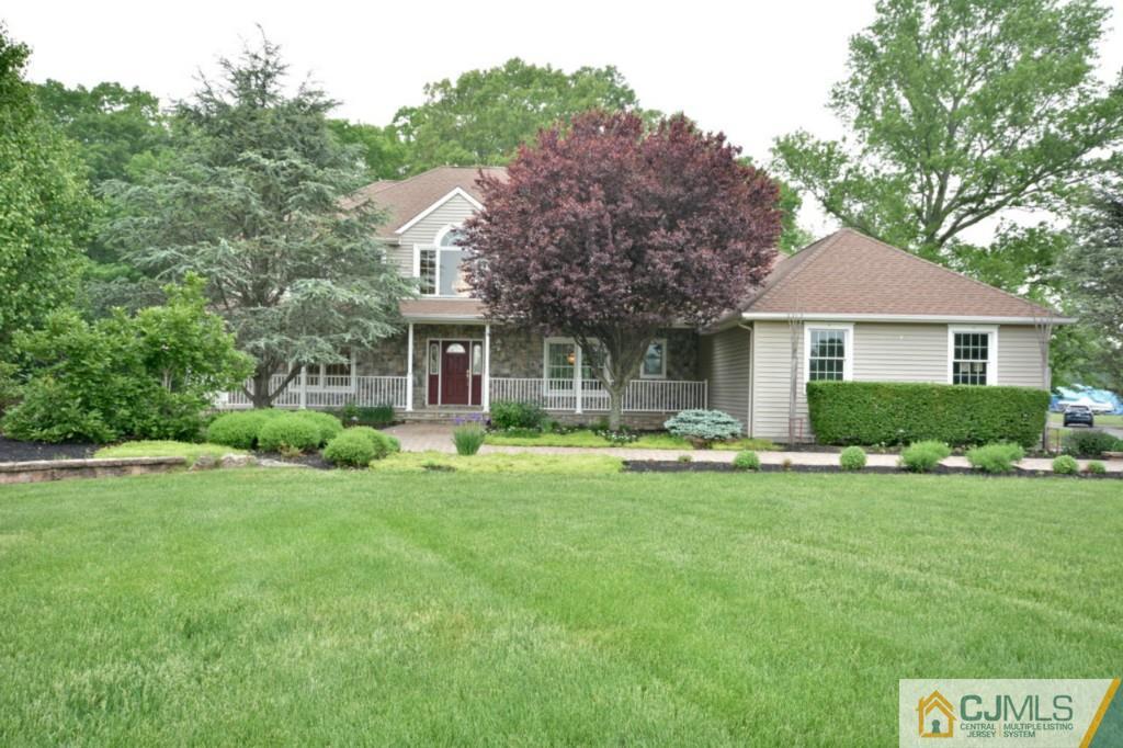 135 Dey Road Cranbury, NJ 08512 - Photo 1 of 25 a front view of a house with a yard and porch