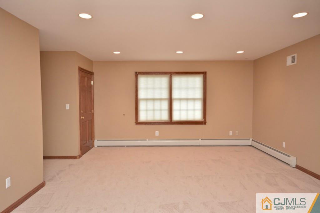 135 Dey Road Cranbury, NJ 08512 - Photo 12 of 25 a view of an empty room with a window