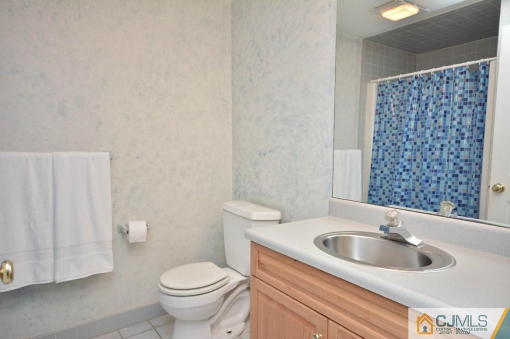 135 Dey Road Cranbury, NJ 08512 - Photo 13 of 25 a bathroom with a sink a toilet and a shower