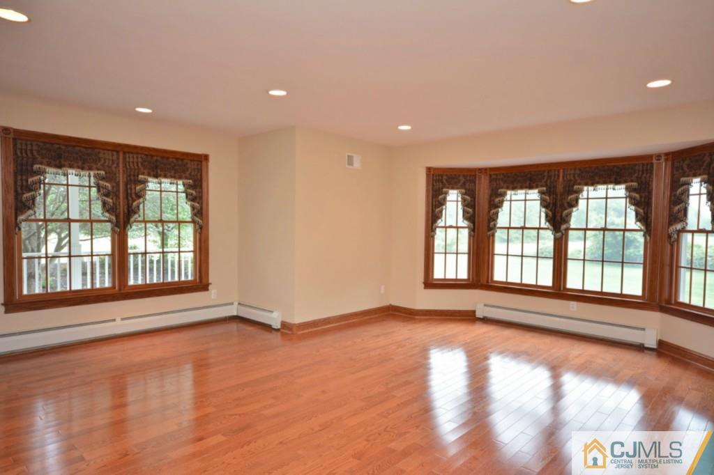 135 Dey Road Cranbury, NJ 08512 - Photo 3 of 25 a view of an empty room with a window