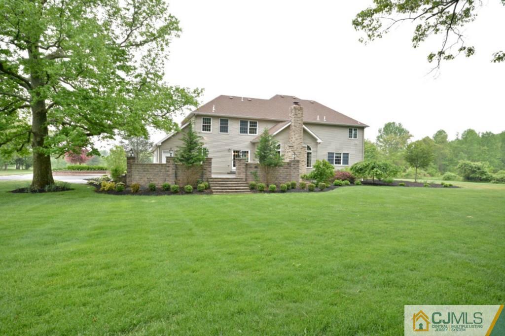 135 Dey Road Cranbury, NJ 08512 - Photo 22 of 25 a front view of a house with garden