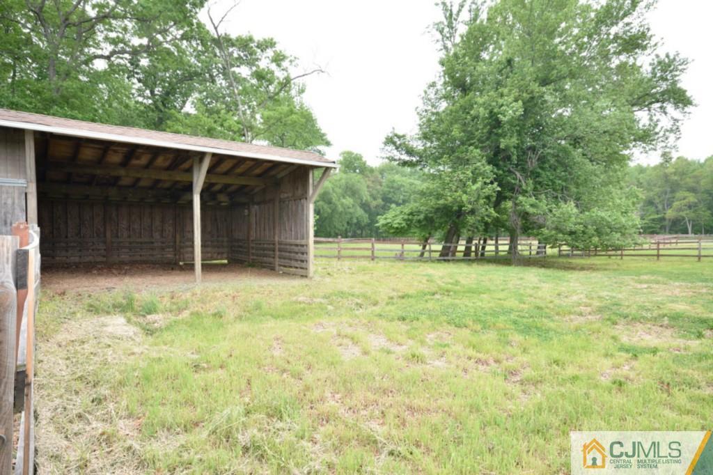 135 Dey Road Cranbury, NJ 08512 - Photo 25 of 25 a backyard of a house with lots of green space