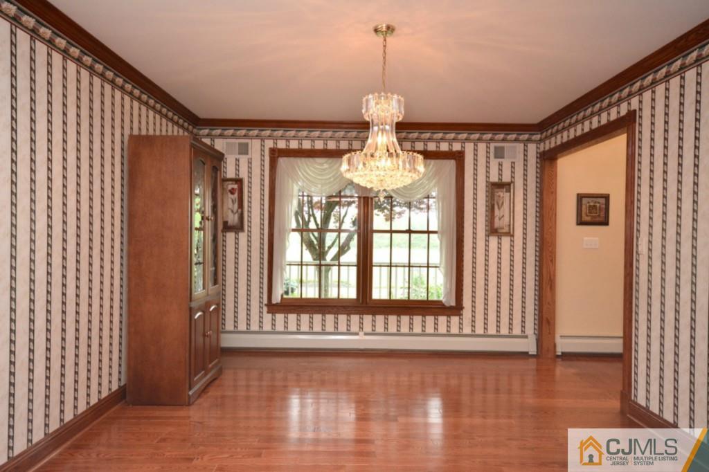135 Dey Road Cranbury, NJ 08512 - Photo 6 of 25 a view of a room with wooden floor and staircase