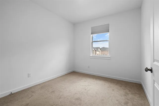 a bed room with a closet and mirror