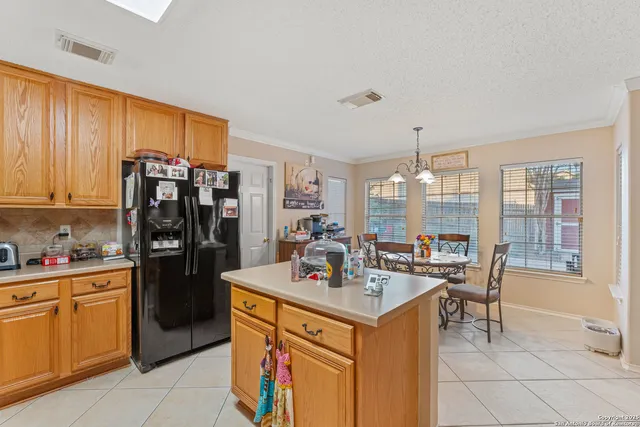 a kitchen with a sink stove and refrigerator