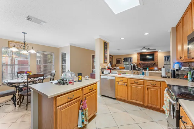 a kitchen with a sink stove and cabinets