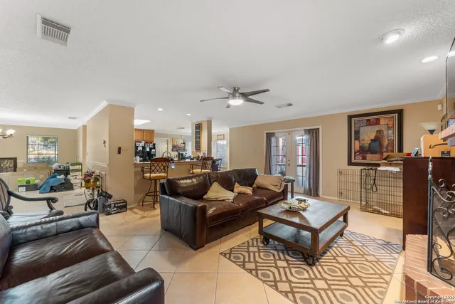 a living room with furniture and a table