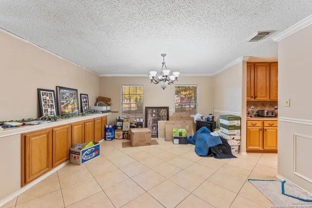 a bed room with furniture and a chandelier