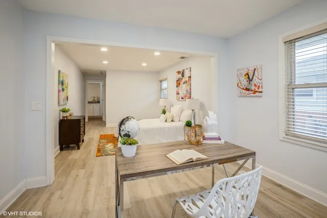a dining room with furniture and window