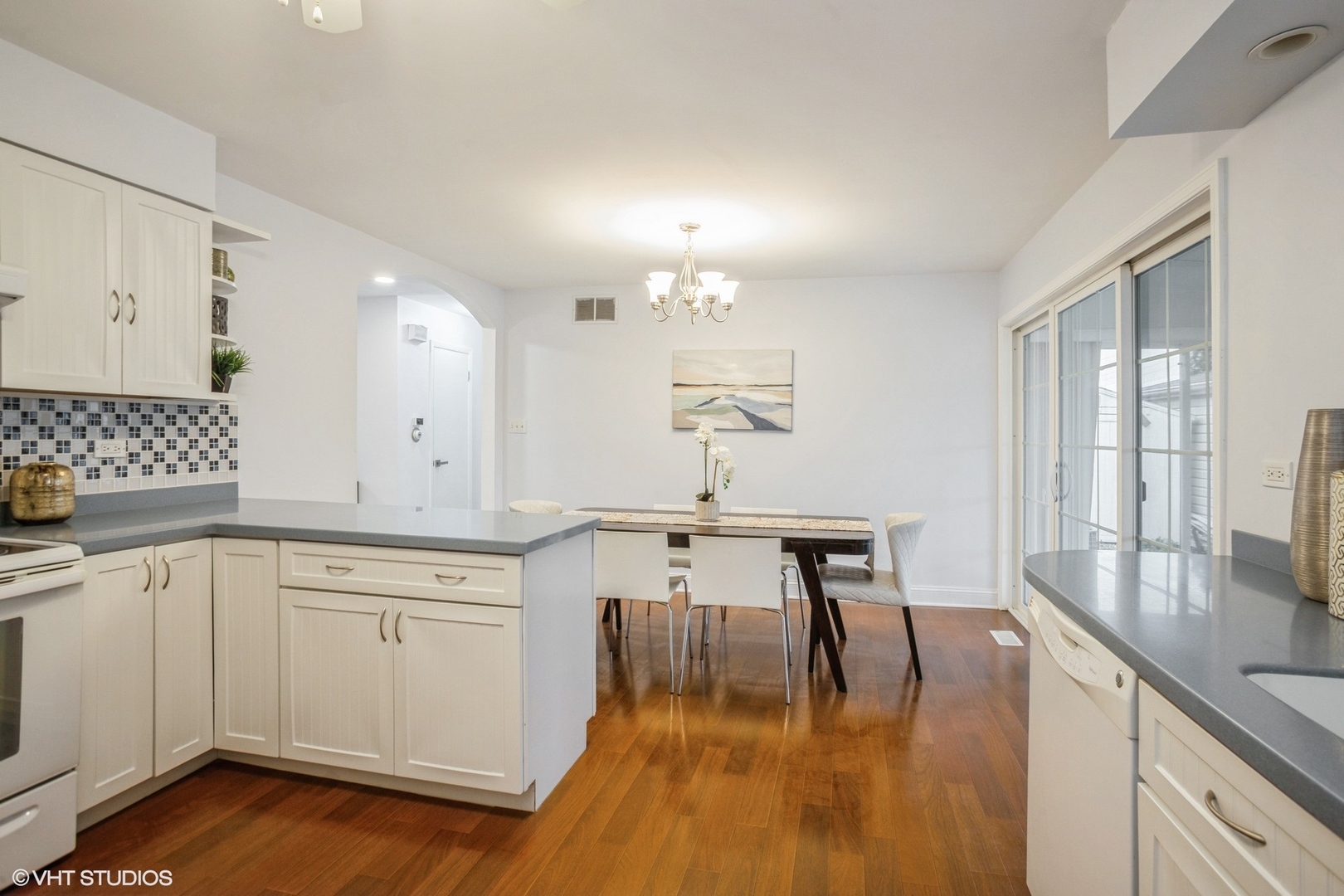 943 Maple Lane Elk Grove Village, IL 60007 - Photo 6 of 17 a kitchen with a sink cabinets and wooden floor