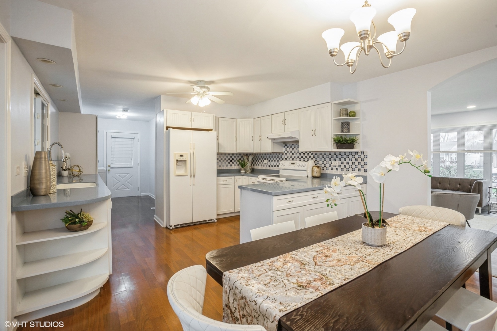 943 Maple Lane Elk Grove Village, IL 60007 - Photo 7 of 17 a living room with stainless steel appliances kitchen island granite countertop furniture and a dining table
