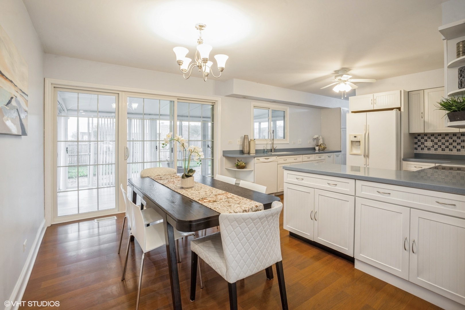 943 Maple Lane Elk Grove Village, IL 60007 - Photo 8 of 17 a large kitchen with kitchen island a large window in it