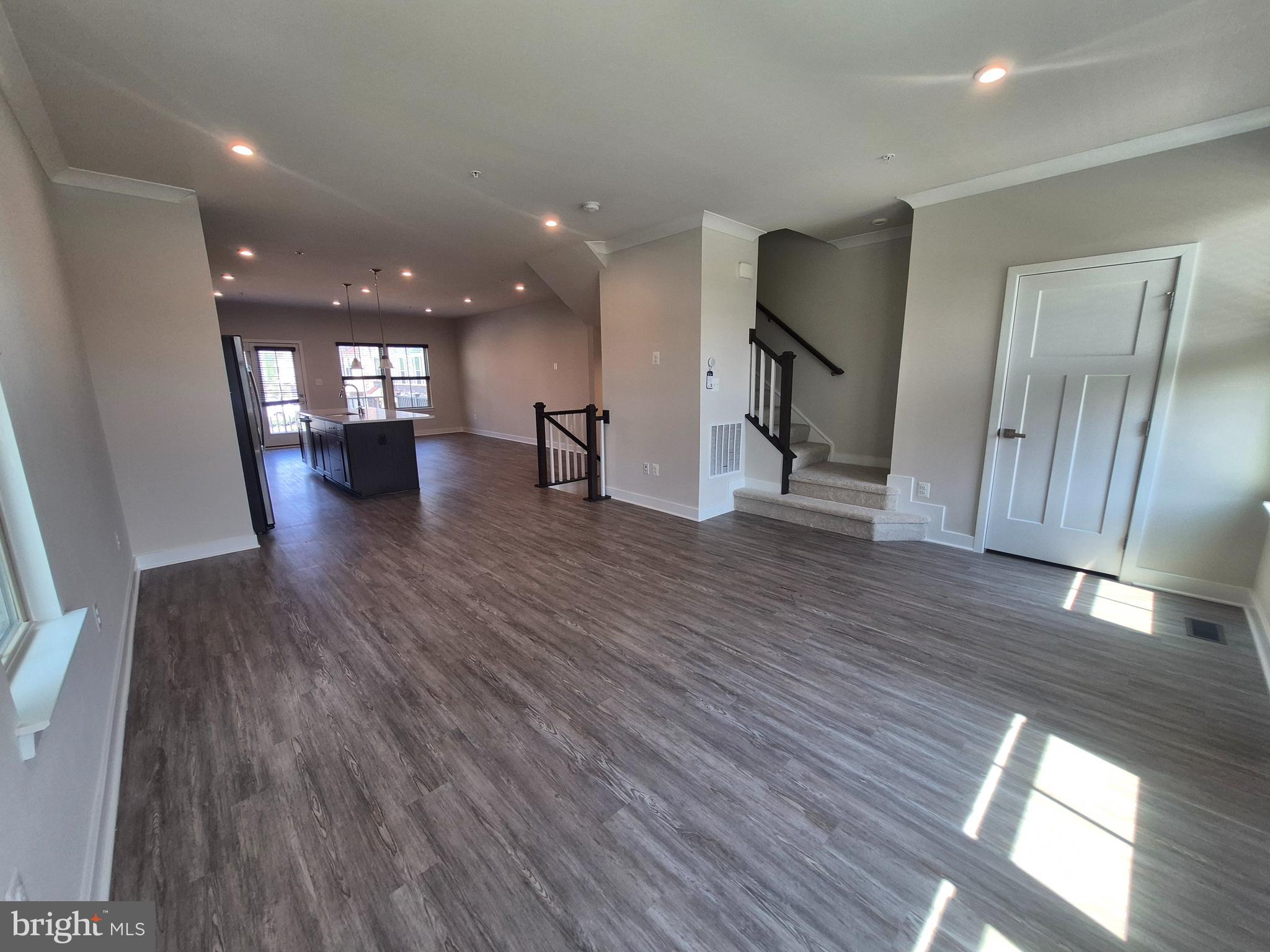 6054 Fallfish Court New Market, MD 21774 - Photo 17 of 28 a view of empty room with wooden floor and window