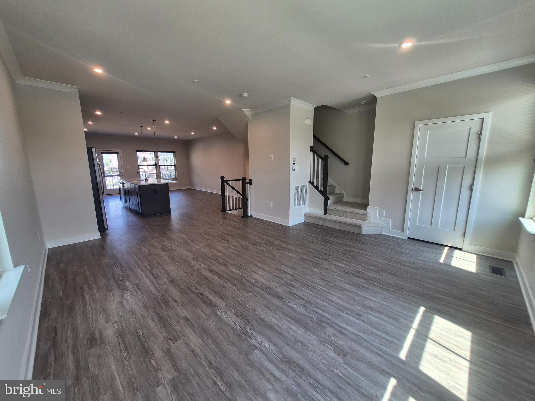 6054 Fallfish Court New Market, MD 21774 - Photo 20 of 28 a view of empty room with wooden floor