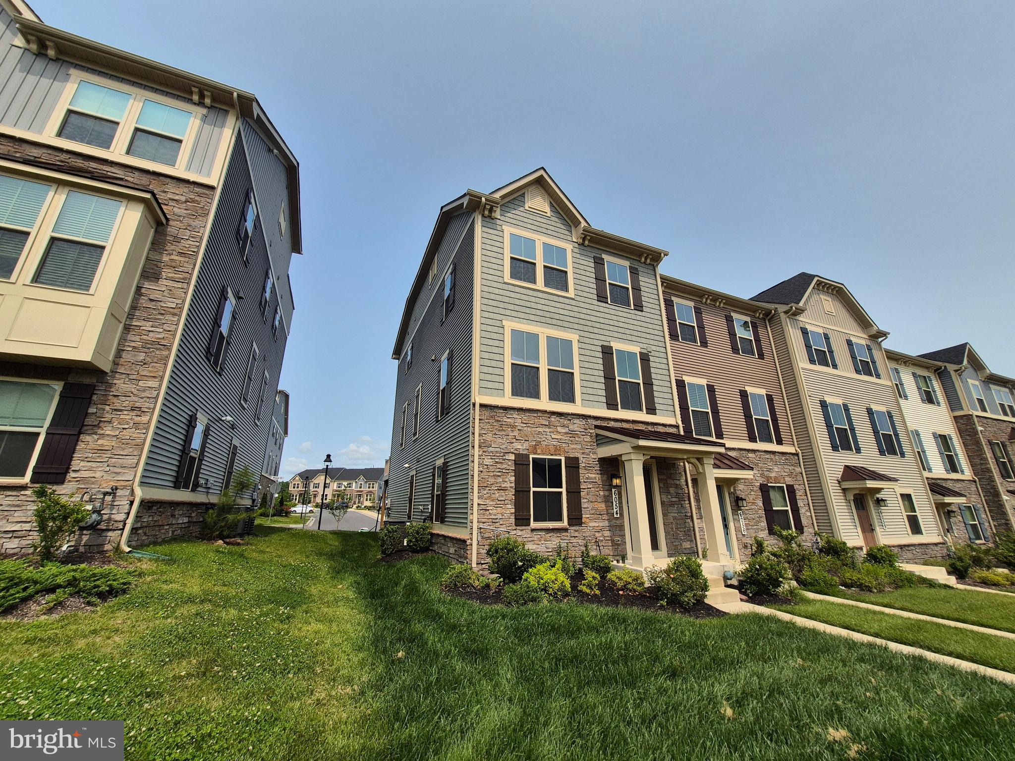 6054 Fallfish Court New Market, MD 21774 - Photo 4 of 28 a front view of a building with a yard