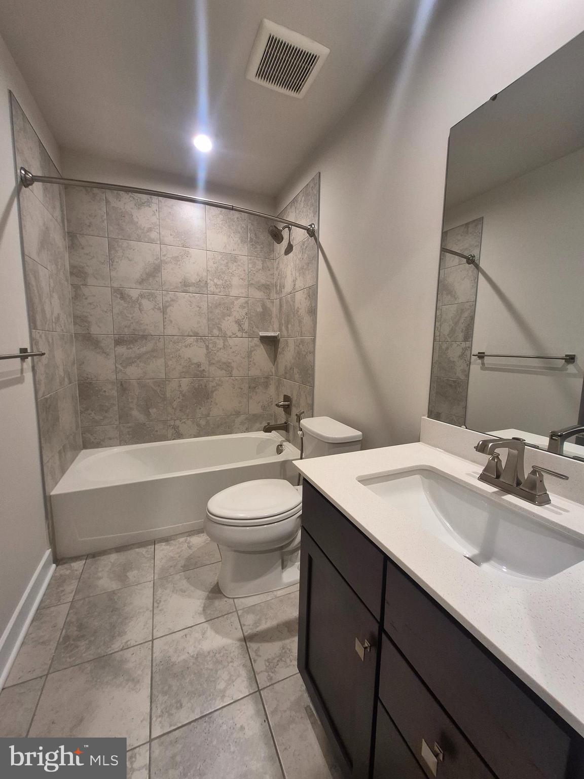 6054 Fallfish Court New Market, MD 21774 - Photo 9 of 28 a bathroom with a sink a toilet and shower