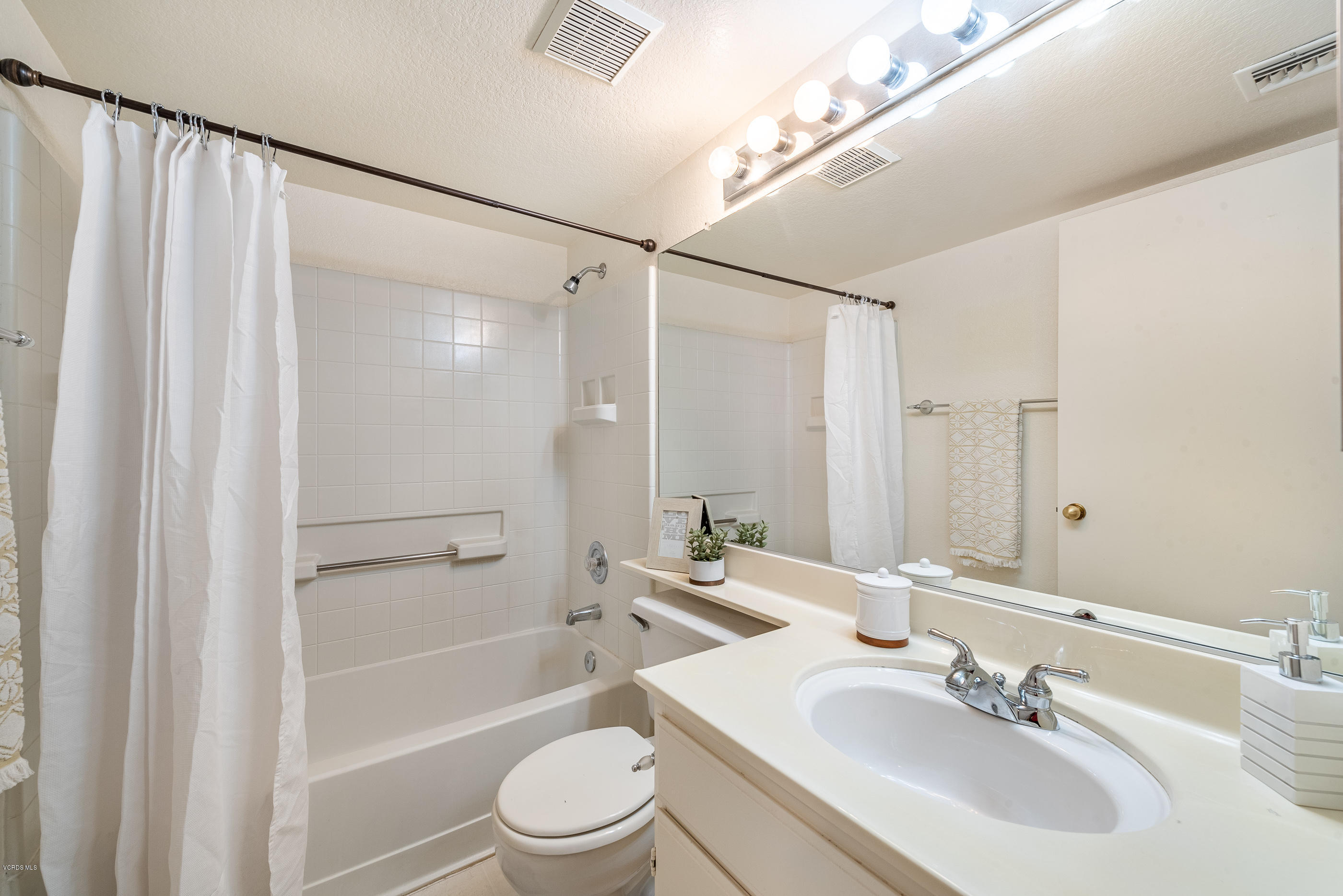 1007 Waltham Road, Unit C Simi Valley, CA 93065 - Photo 12 of 25 a bathroom with a sink a toilet and shower