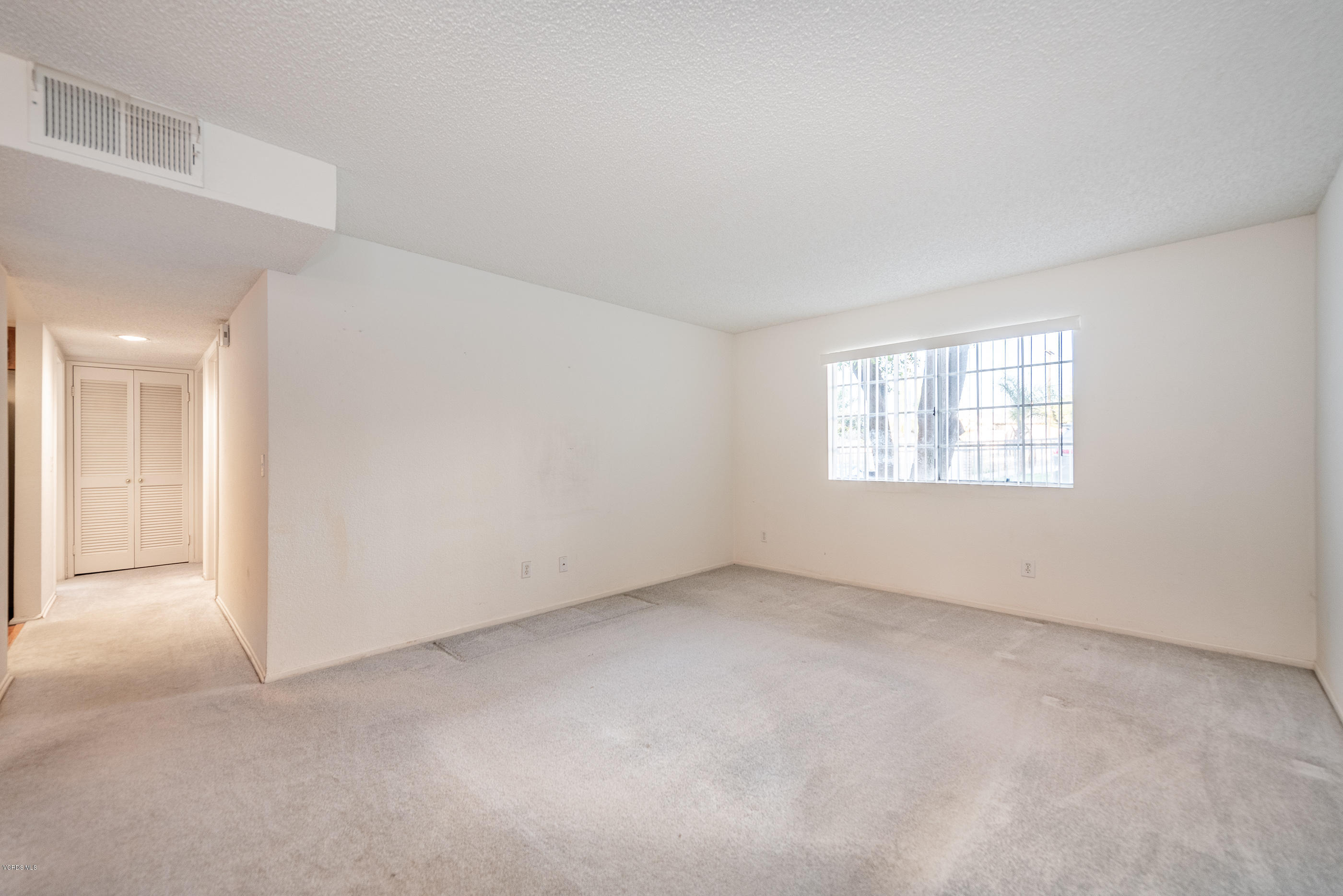 1007 Waltham Road, Unit C Simi Valley, CA 93065 - Photo 4 of 25 an empty room with windows