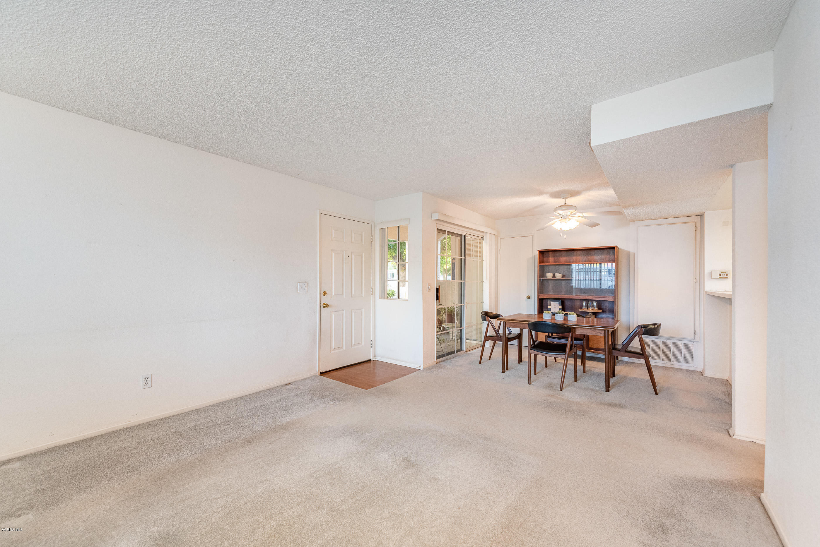 1007 Waltham Road, Unit C Simi Valley, CA 93065 - Photo 5 of 25 a view of a livingroom and a dining room with furniture and a window