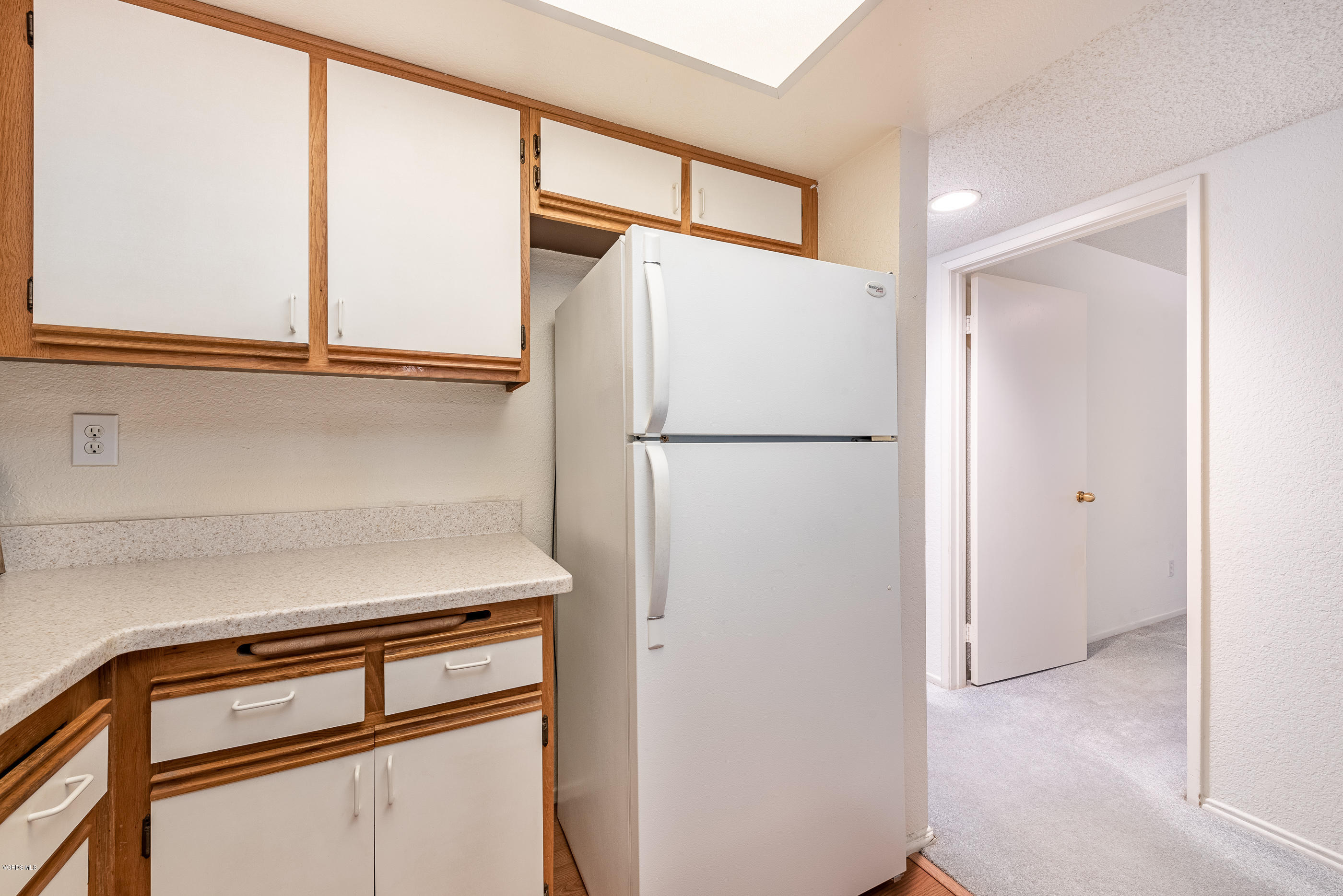 1007 Waltham Road, Unit C Simi Valley, CA 93065 - Photo 9 of 25 a white refrigerator freezer and a stove sitting inside of a kitchen