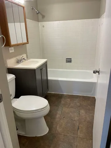 a bathroom with a sink toilet and a bathtub