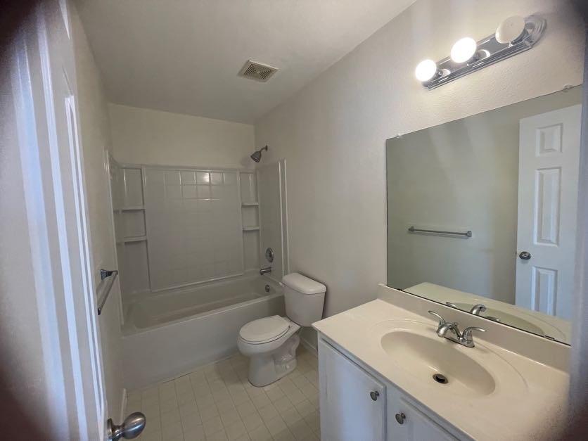 12645 Pricklybranch Drive Fort Worth, TX 76244 - Photo 15 of 21 a bathroom with a sink a toilet and shower