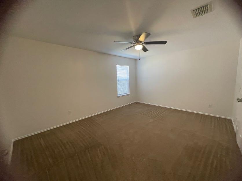 12645 Pricklybranch Drive Fort Worth, TX 76244 - Photo 19 of 21 an empty room with a fan & a window