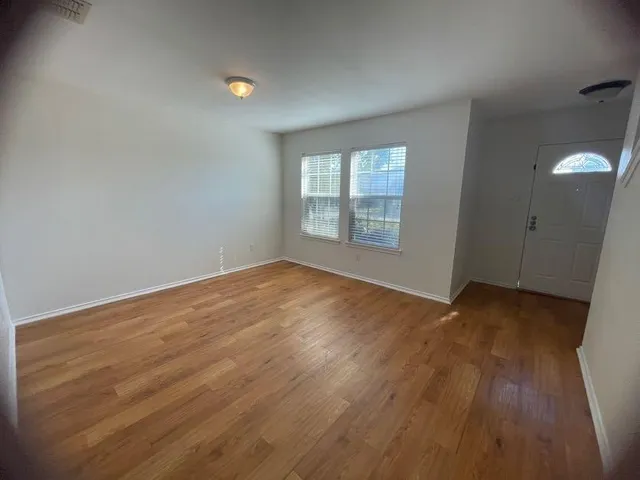 an empty room that has a window
