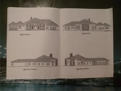 an aerial view of a house with a lake view