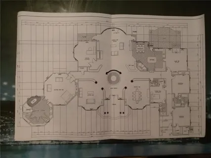 a bathroom with a granite countertop sink and a white shower