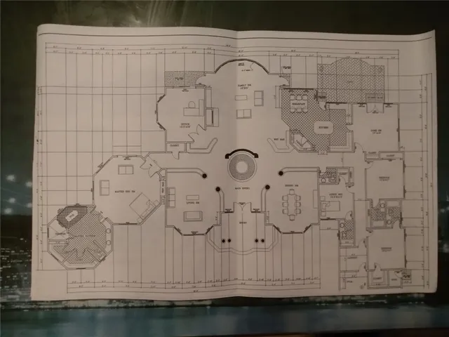 a bathroom with a granite countertop sink and a white shower