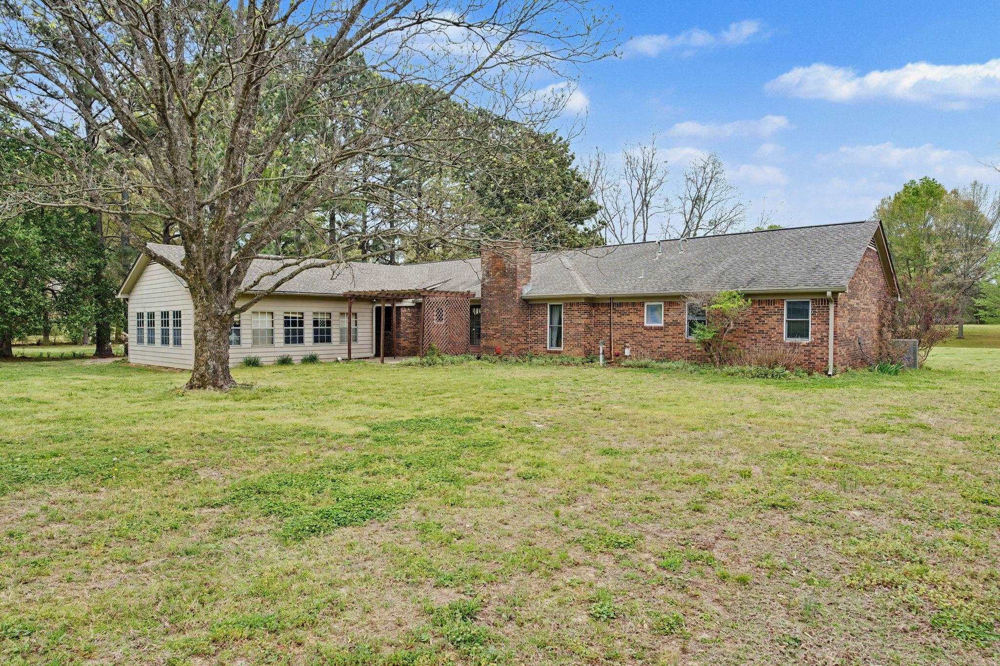 11380 Sycamore Farms Road Collierville, TN 38017 - Photo 32 of 35 Ranch-style home featuring a front lawn and brick siding