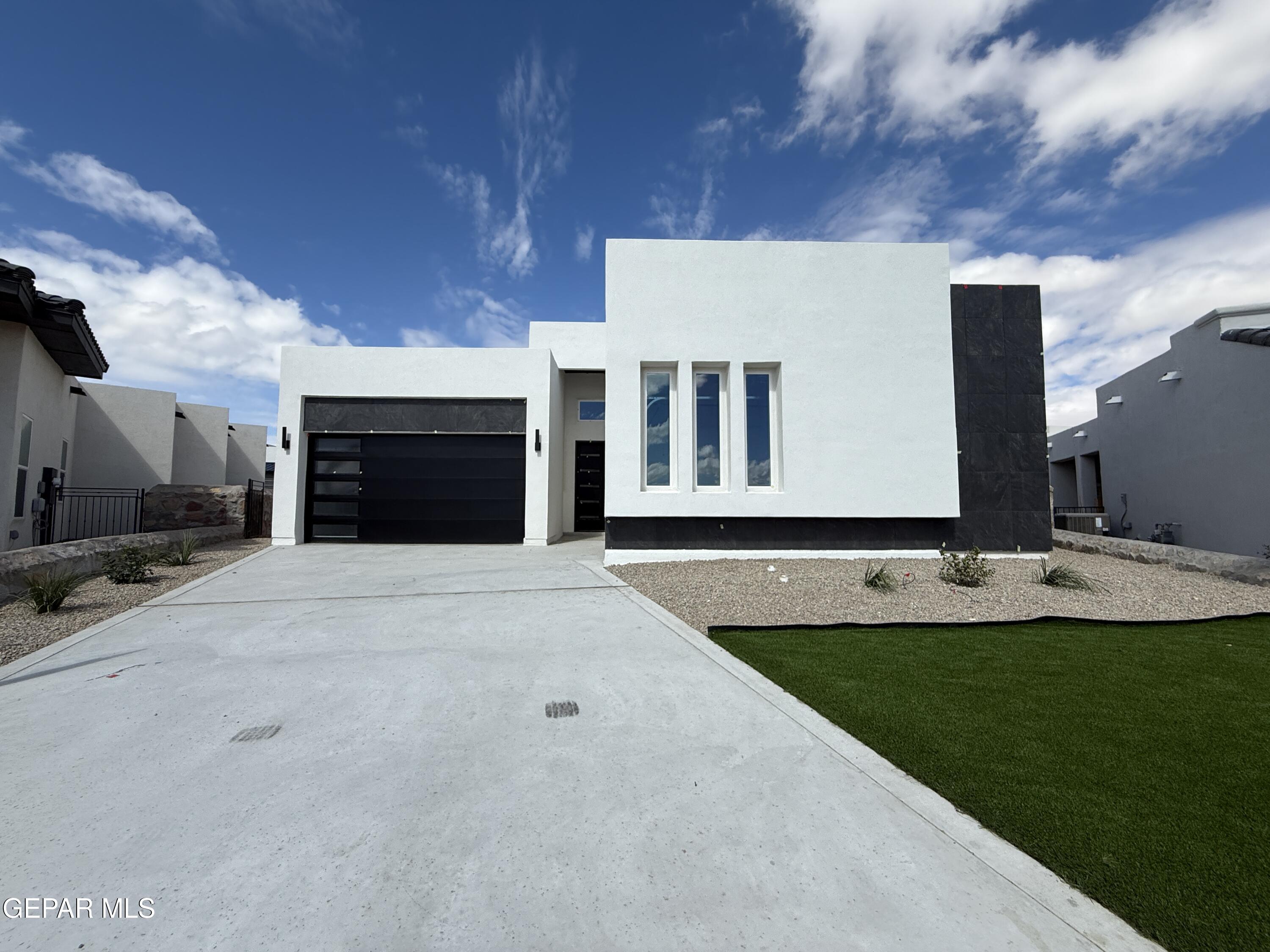 a view of an house with backyard and kitchen