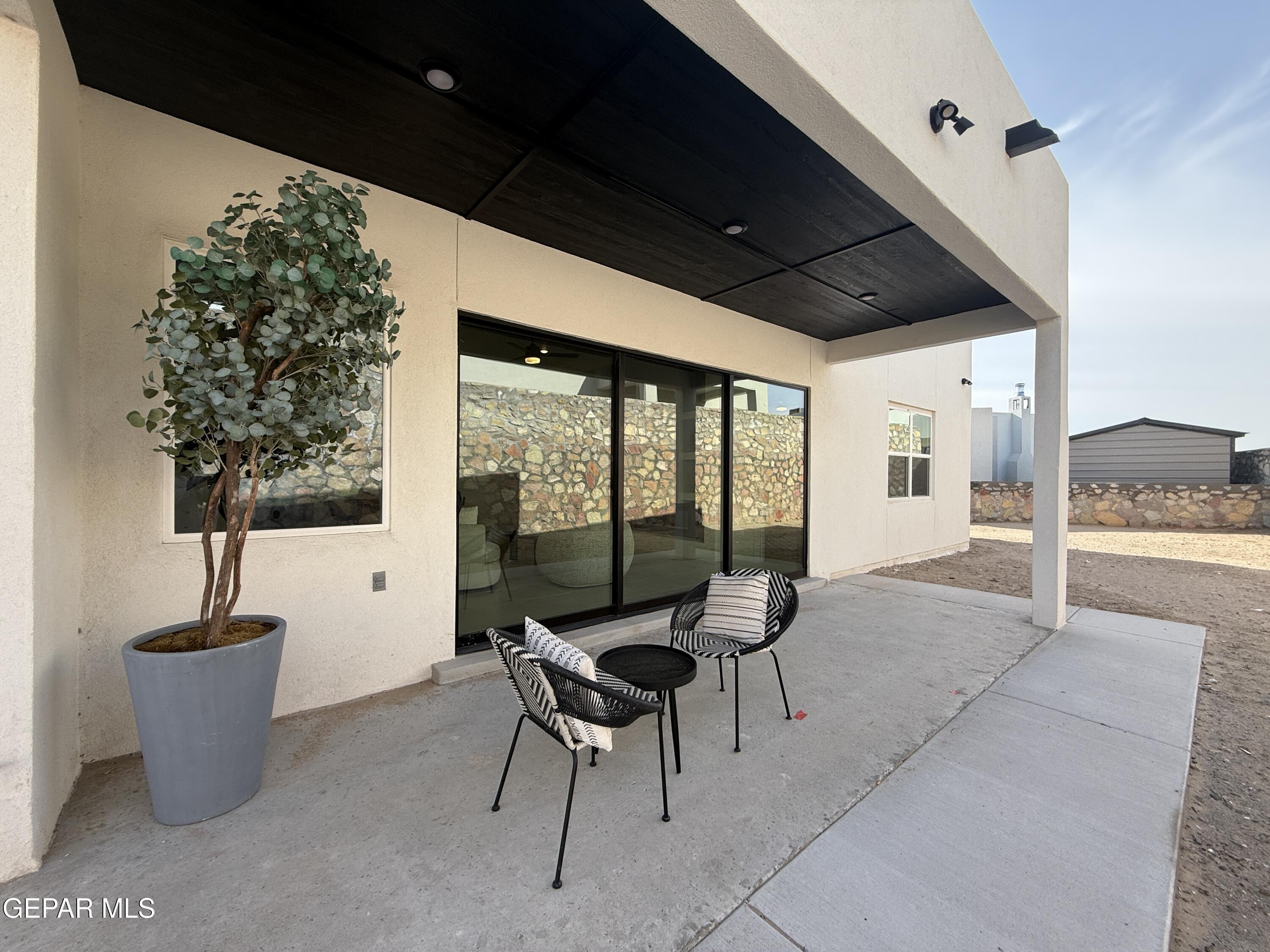 12505 Exton Court El Paso, TX 79928 - Photo 24 of 28 a living room with furniture and a potted plant