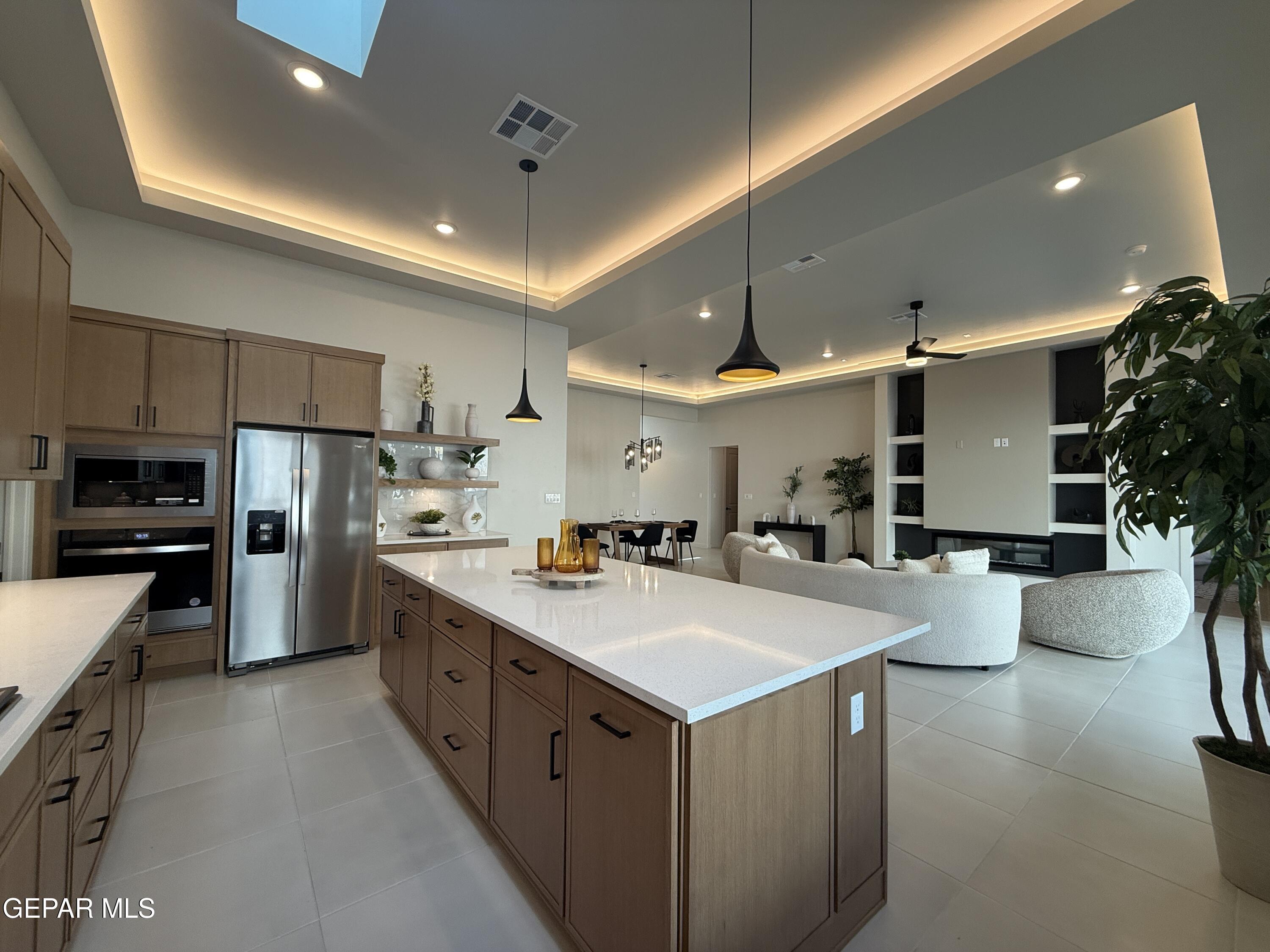 12505 Exton Court El Paso, TX 79928 - Photo 9 of 28 a kitchen with a sink a counter top space stainless steel appliances and cabinets