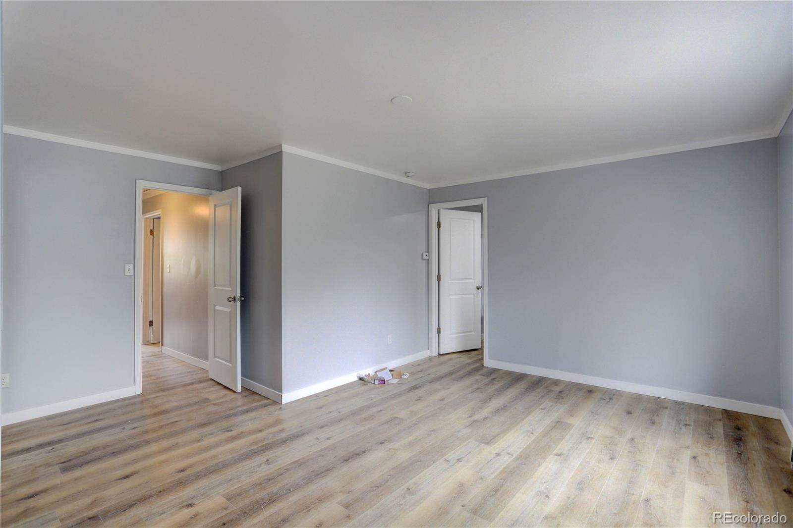 4315 Balsam Street Wheat Ridge, CO 80033 - Photo 14 of 34 a view of an empty room with wooden floor and closet