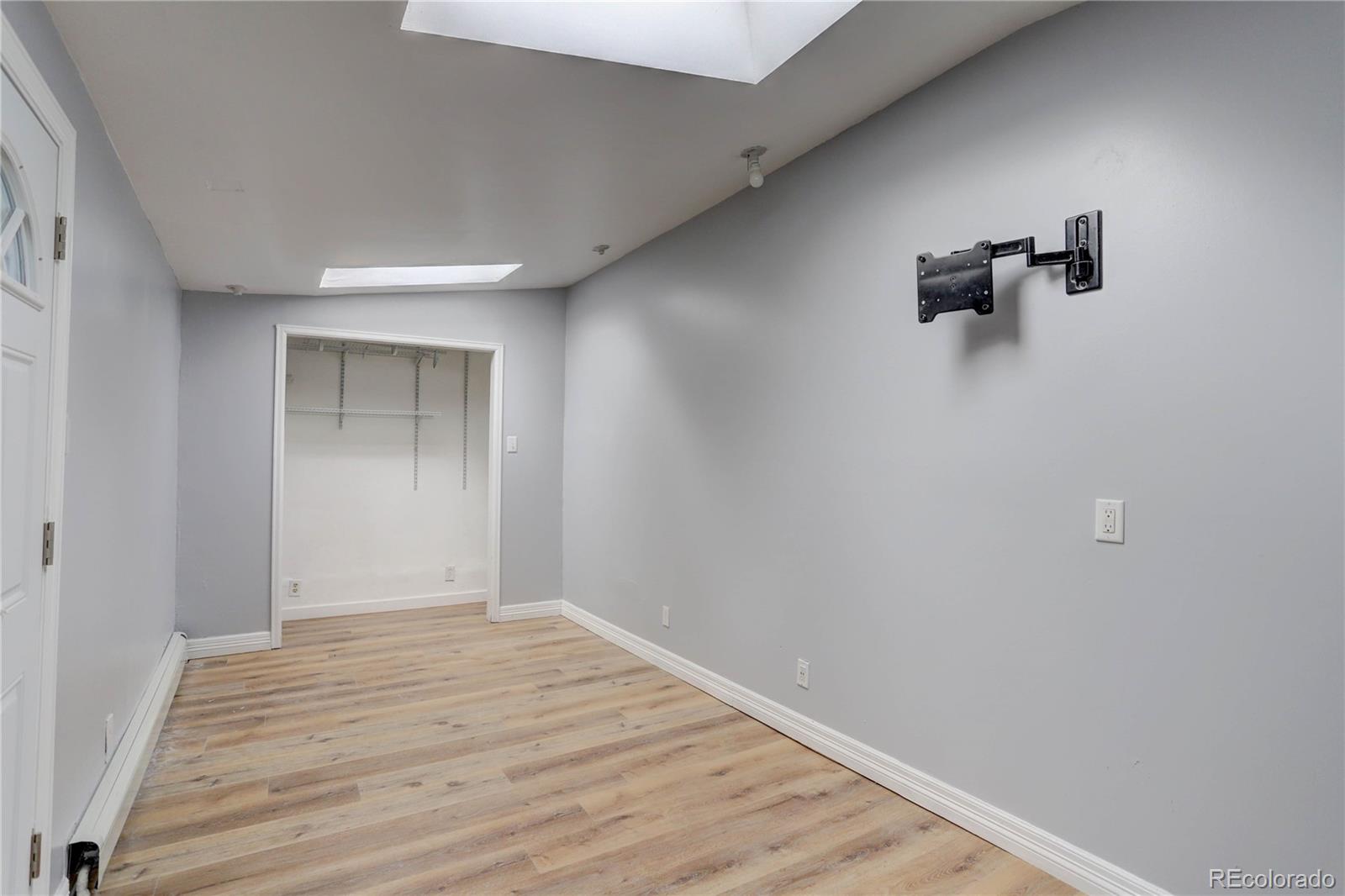 4315 Balsam Street Wheat Ridge, CO 80033 - Photo 17 of 34 a view of empty room with wooden floor