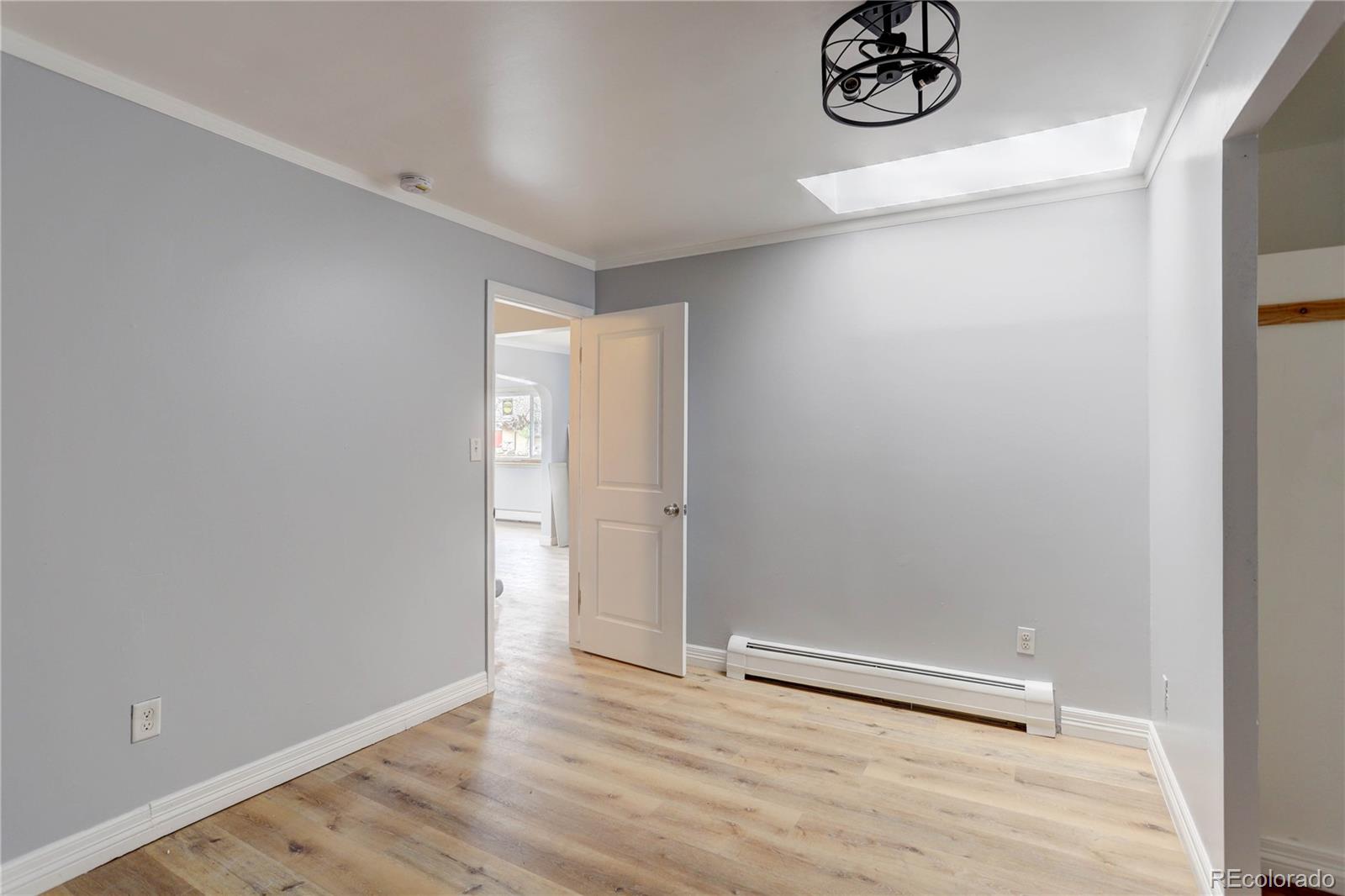 4315 Balsam Street Wheat Ridge, CO 80033 - Photo 18 of 34 a view of an empty room with a window