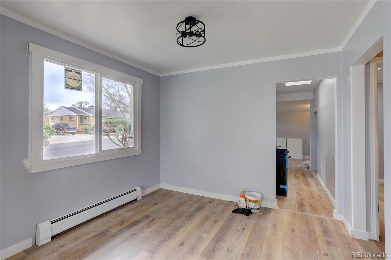 4315 Balsam Street Wheat Ridge, CO 80033 - Photo 21 of 34 a view of a room with wooden floor and a window